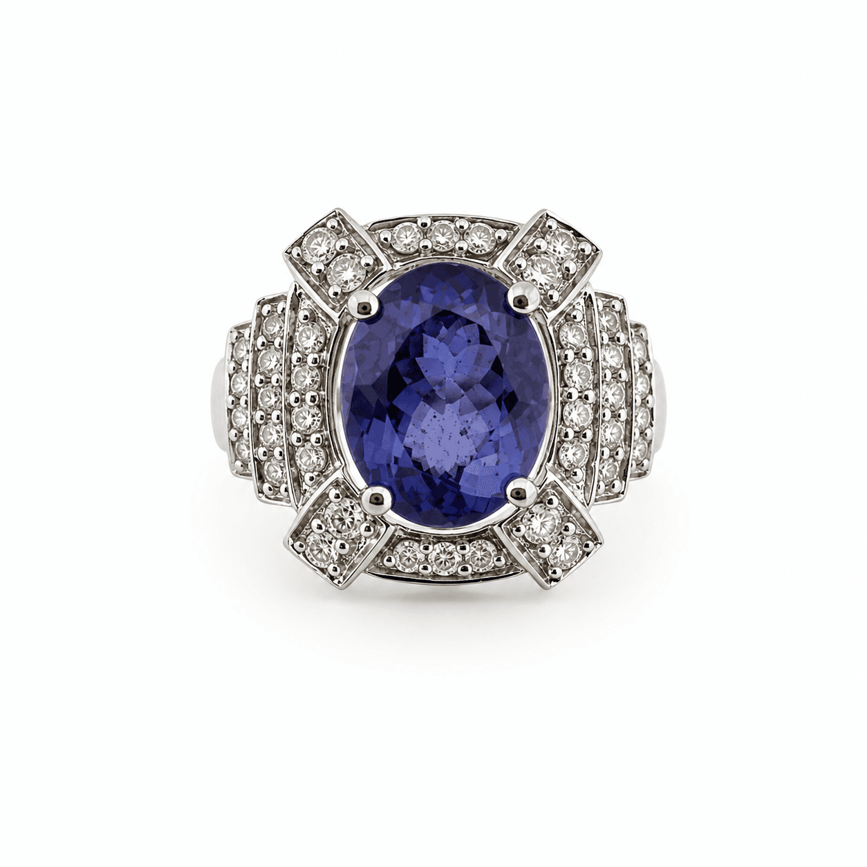 Oval tanzanite ring in 14kt white gold shown from above with tiered diamond halo setting