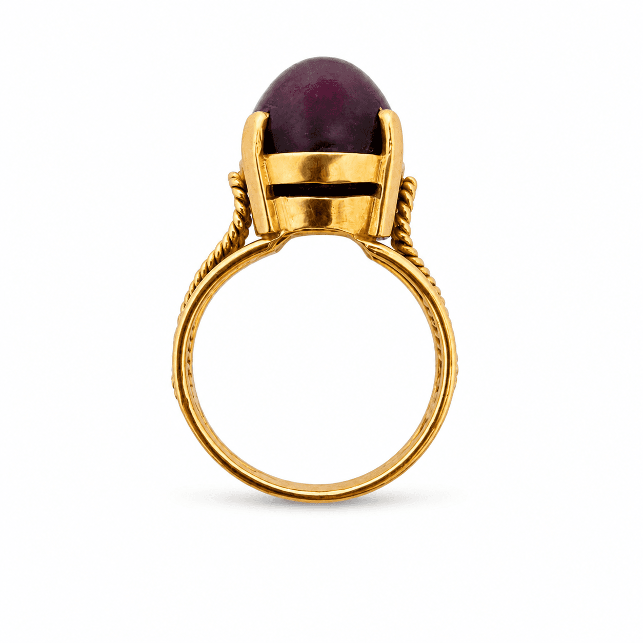 Star ruby ring shown in profile view highlighting the 14K yellow gold prong setting and open gallery beneath the cabochon