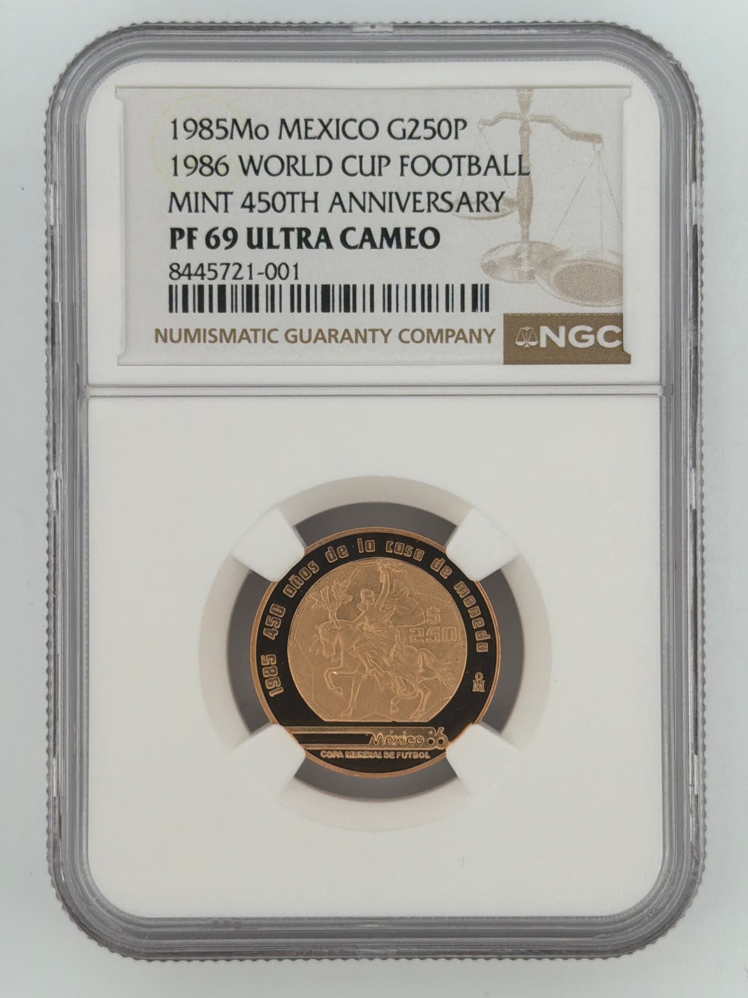 1985-Mo Mexico 250 Pesos gold proof coin in NGC PF 69 Ultra Cameo holder showing reverse with equestrian figure and Mexico 86 World Cup logo