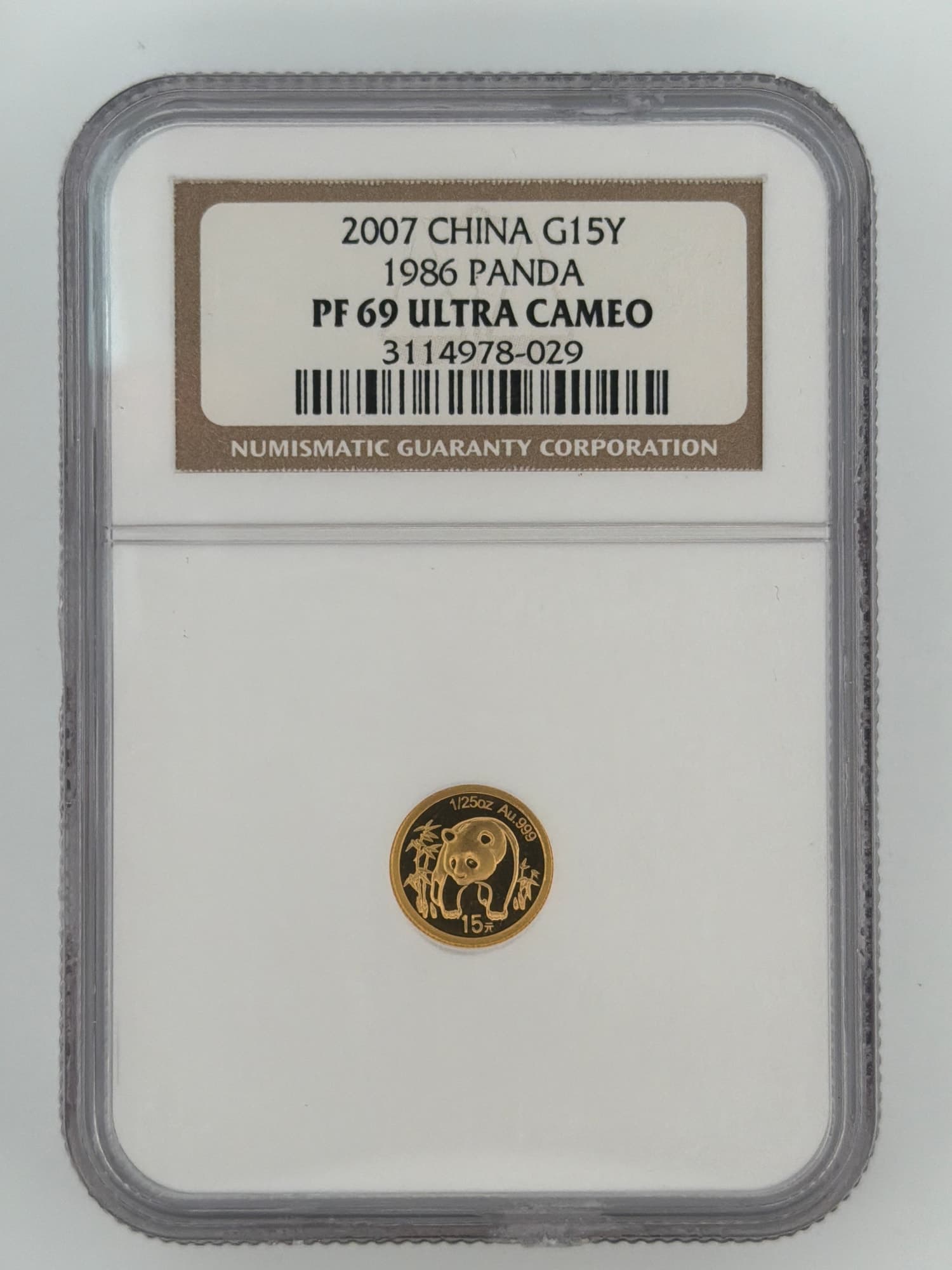 2007 China 1/25 oz Gold Panda 15 Yuan NGC PF69 Ultra Cameo slab obverse showing 1986 Panda reverse design with bamboo