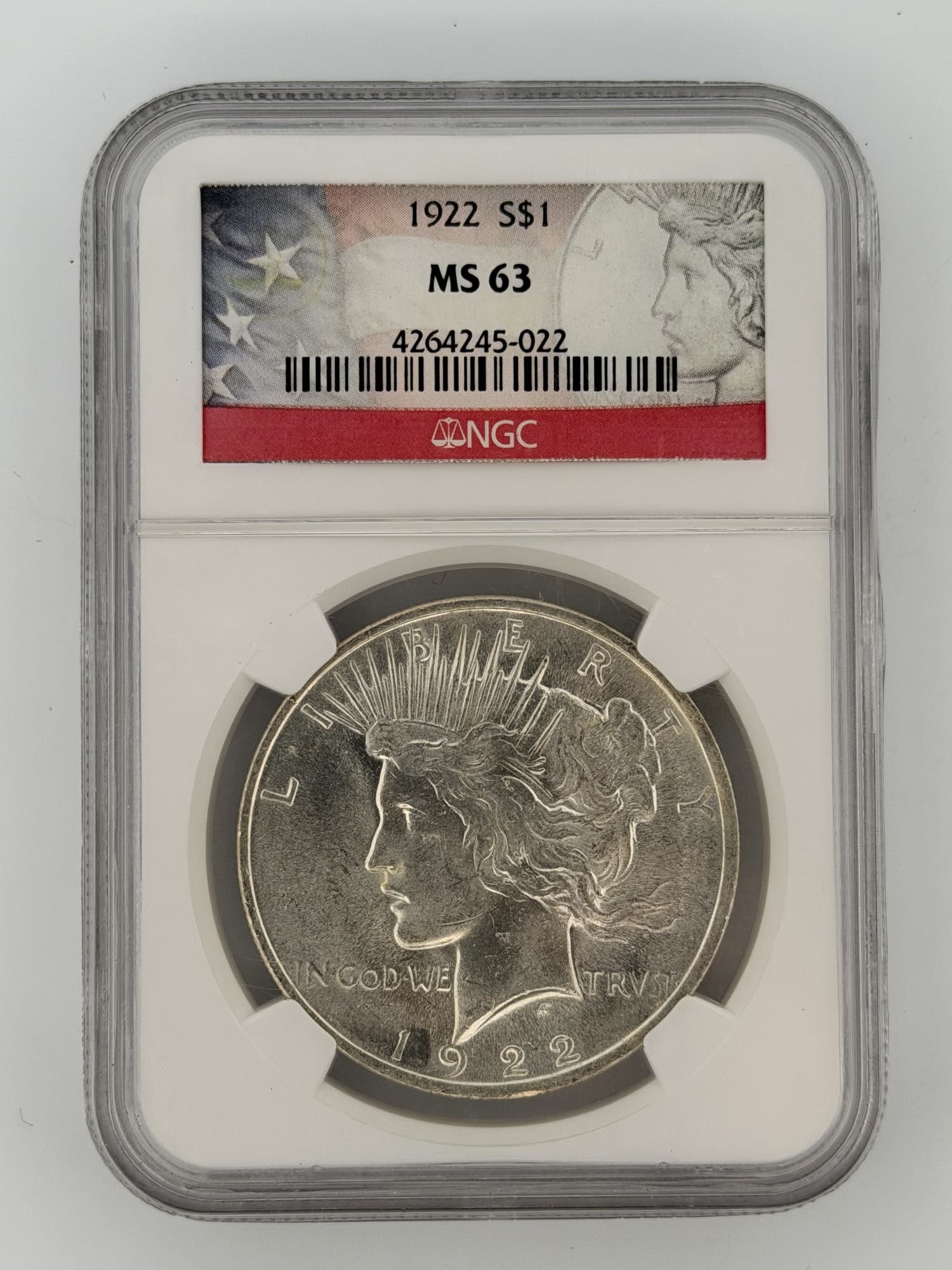 1922 Peace Silver Dollar NGC MS-63 obverse in slab showing Liberty portrait and radiate crown, certification label visible